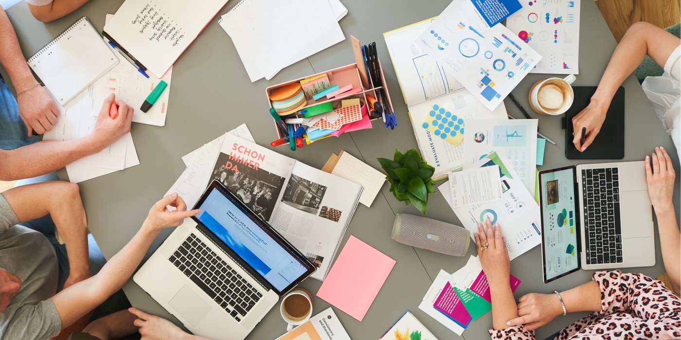 a woman and a man working with a customer journey map